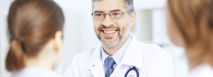 A doctor smiling