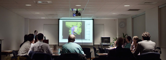 A group of people attending a presentation