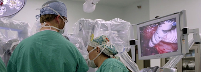 Two medical professionals conducting surgery